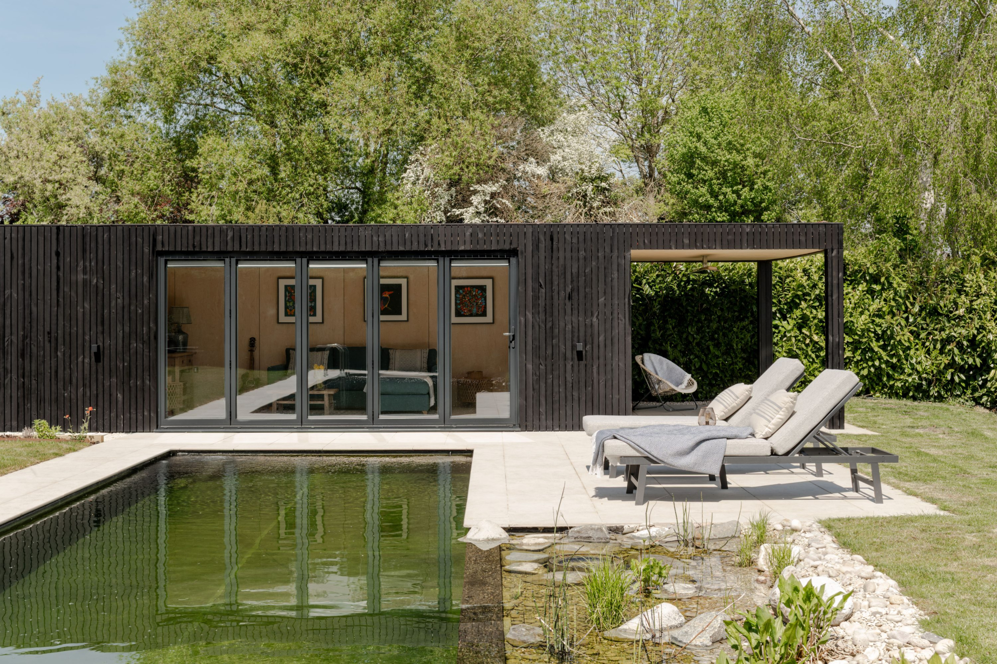 Modern black charred timber garden room with bi-fold doors