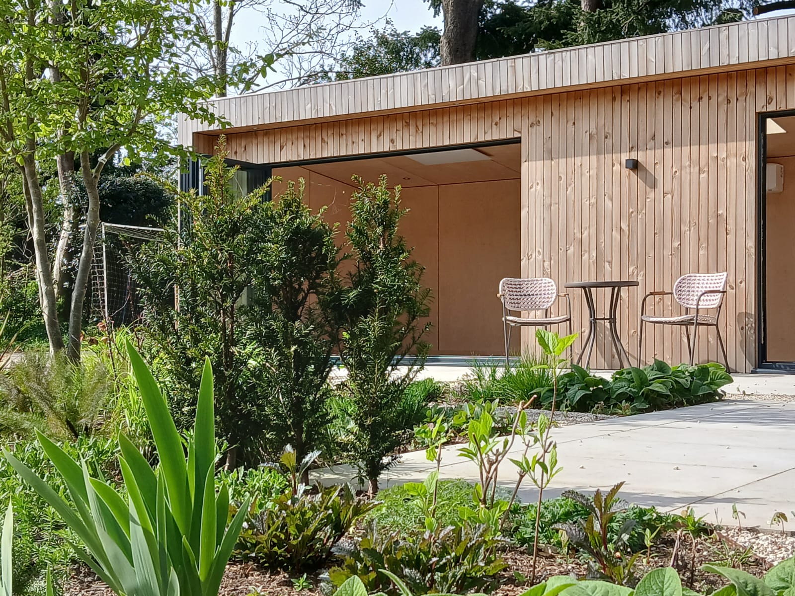 A modern, fully-integrated kitchenette in a garden pod, highlighting the self-contained residential capabilities of the structure.