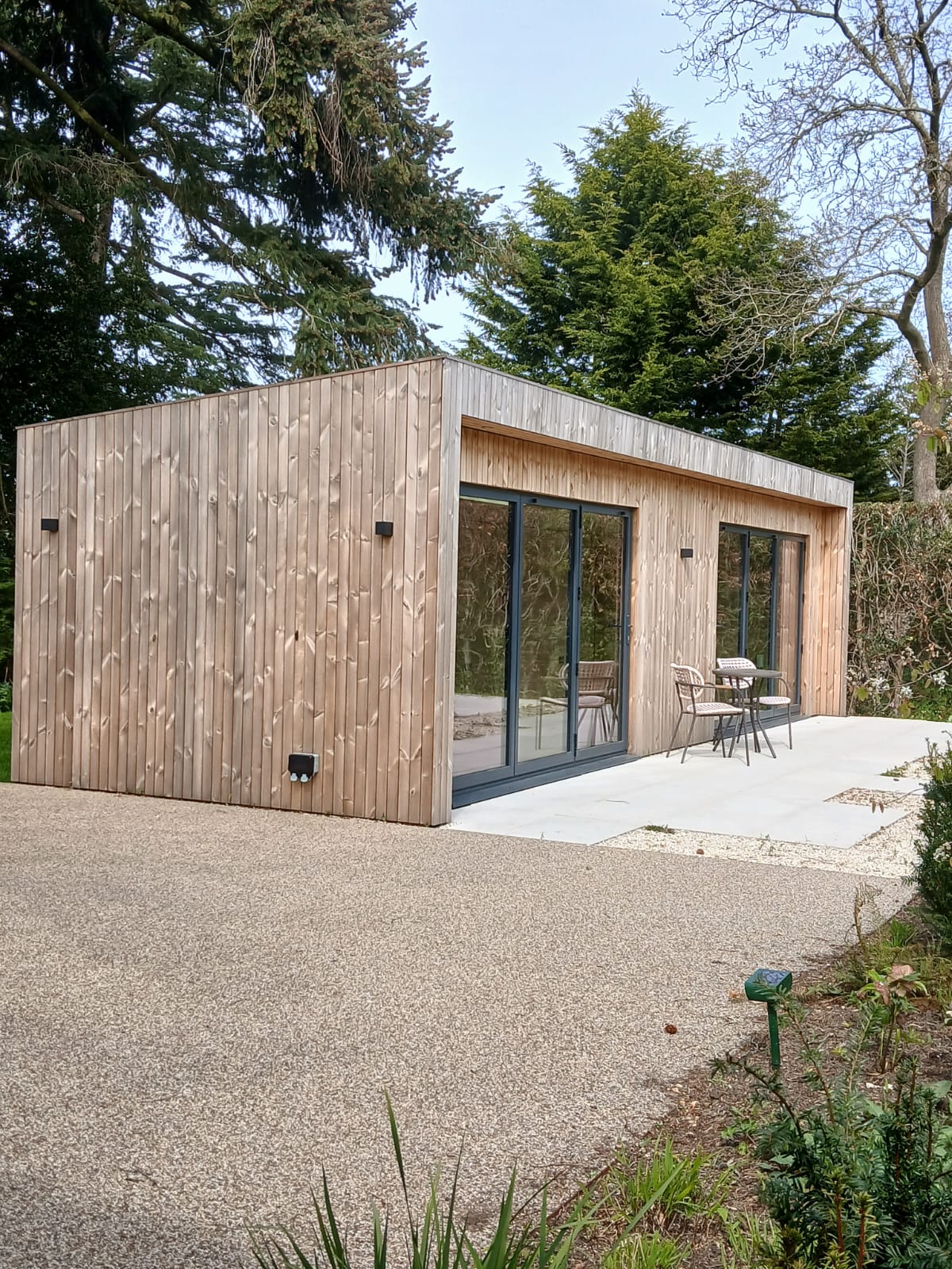 Close-up of the premium timber cladding on a large garden pod, demonstrating the high-end finish and craftsmanship.