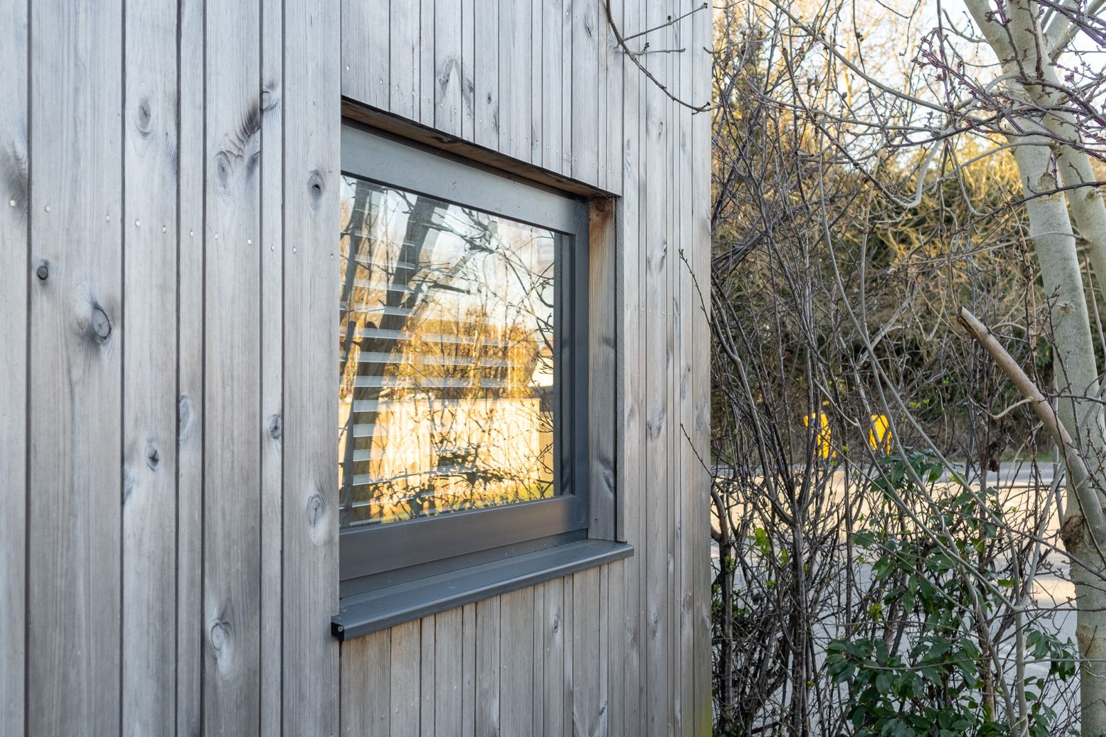 Contemporary backyard office pod designed as a sleek outdoor retreat with sustainable timber materials and clean modern rooflines.