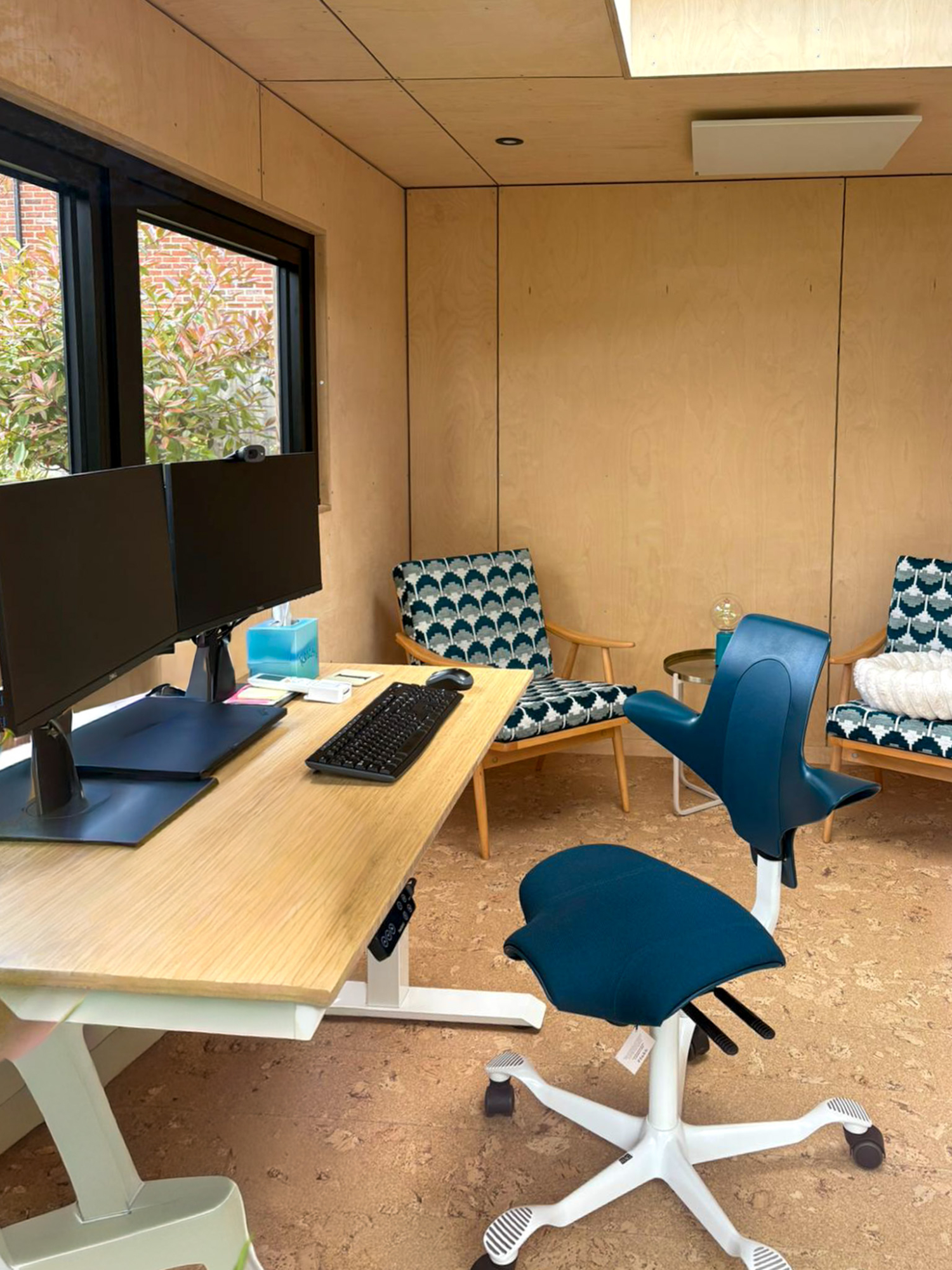 Side profile of a modular Cambridge backyard office pod, emphasizing sustainable timber materials and high-specification double-glazed windows.